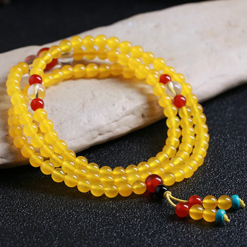 108-bead agate necklace with crystal lucky cat charm and geometric polished beads