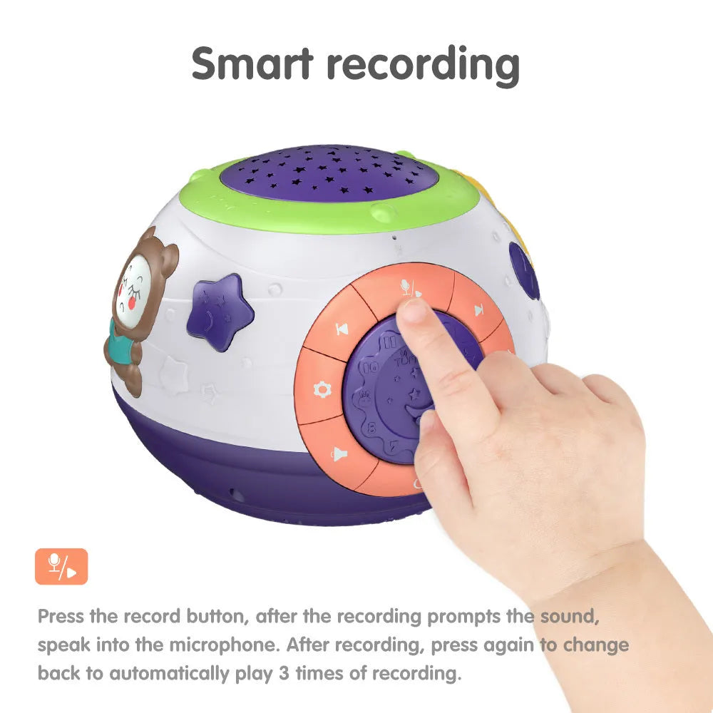 White plastic starry sky night light projector for children on a table, projecting blue stars onto a wall.