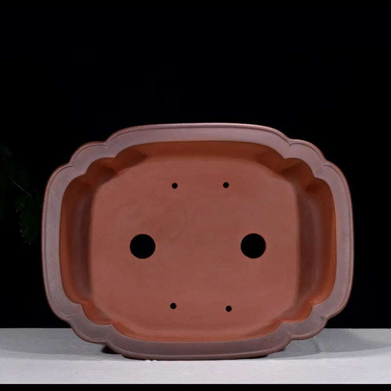 Large antique finish purple clay rectangular flowerpot with carved Chinese tree stump, pine, cypress, and fruit designs.