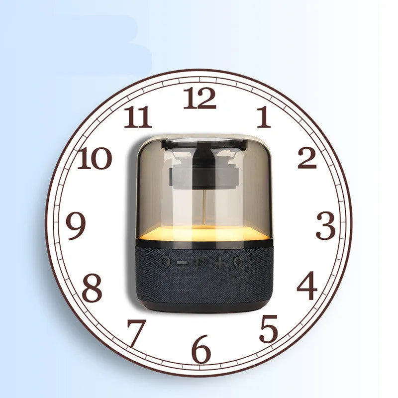 Black portable Bluetooth speaker with multi-colour LED light ring and control buttons on top.