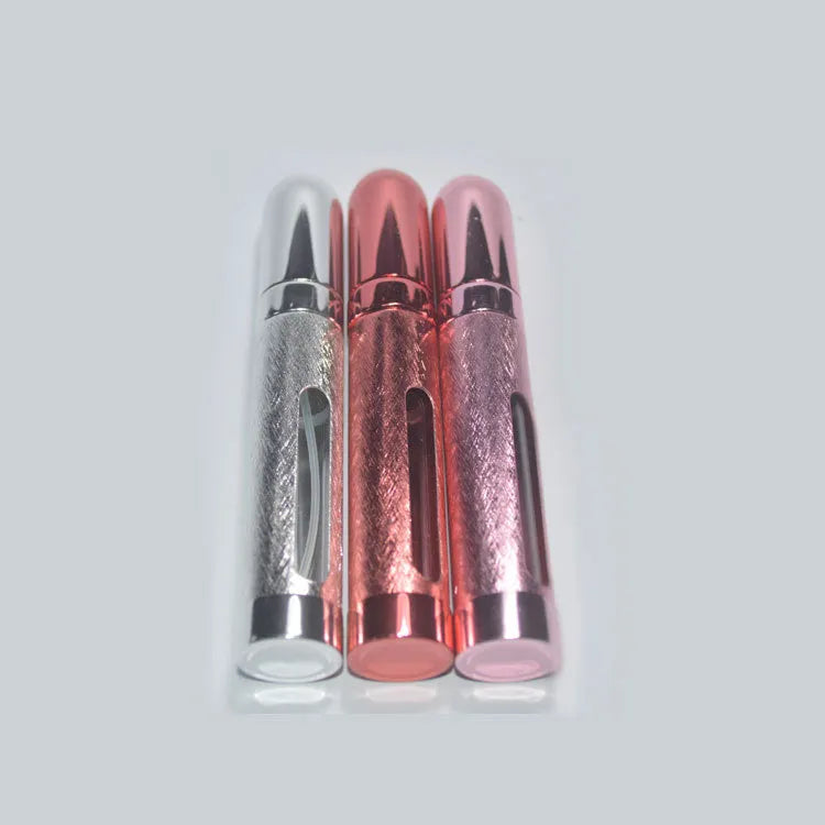 Blue aluminium travel perfume atomiser bullet bottle with glass liner, 12ml capacity.