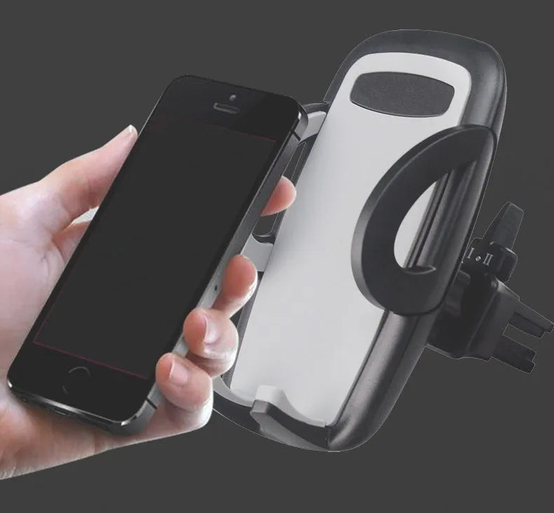 Black universal mobile phone holder clipped to car air conditioning outlet