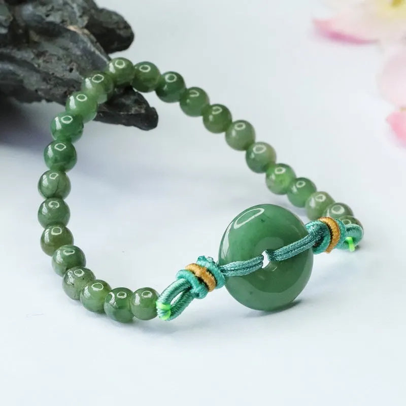 Oil green jade bracelet with safety buckle closure showing star-shaped 6mm beads
