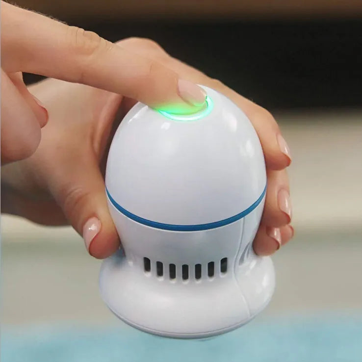 Beige electric foot file grinder with diamond grinding heads and USB charging cable