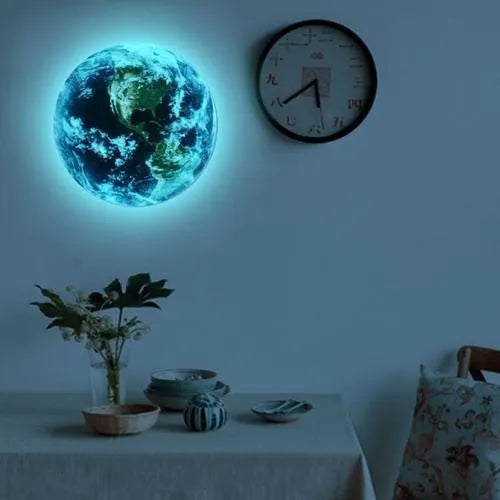 Glow in the dark 3D planet Earth wall sticker in various sizes on a blue wall
