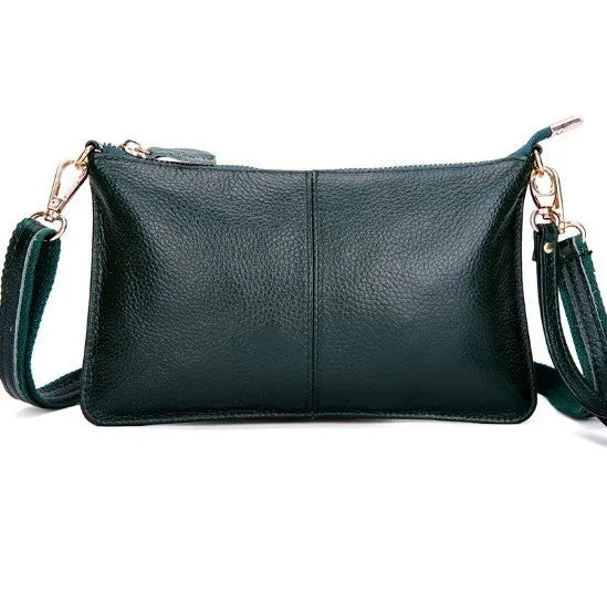 A cowhide lady slant bag in a chosen colour, showing hand and shoulder straps, with dimensions of 24 cm by 14 cm.