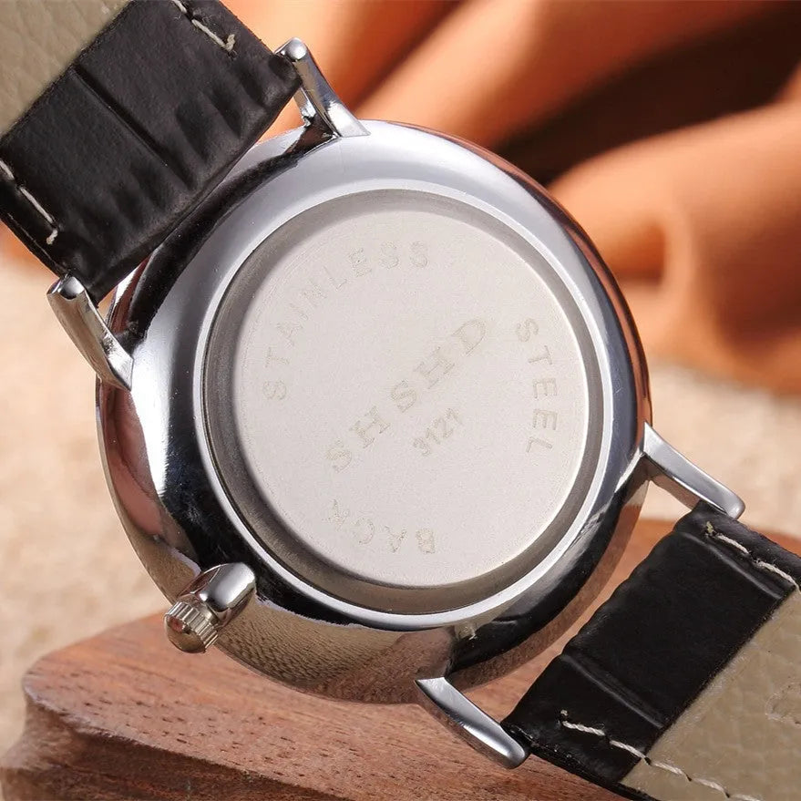 Neutral casual quartz watch with round 38mm dial, black strap, and alloy case on a plain background