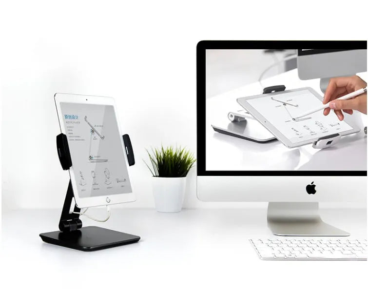 Silver foldable aluminium phone tablet holder on desk showing 360° rotation