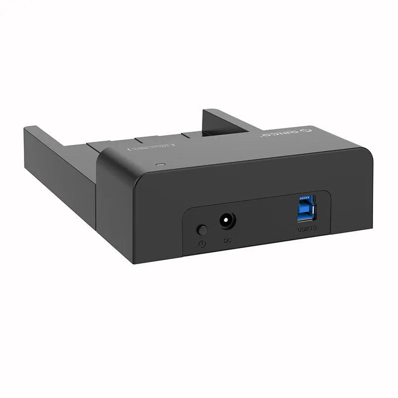 Black plastic 2.5 inch SATA hard drive enclosure with USB cable on a desk