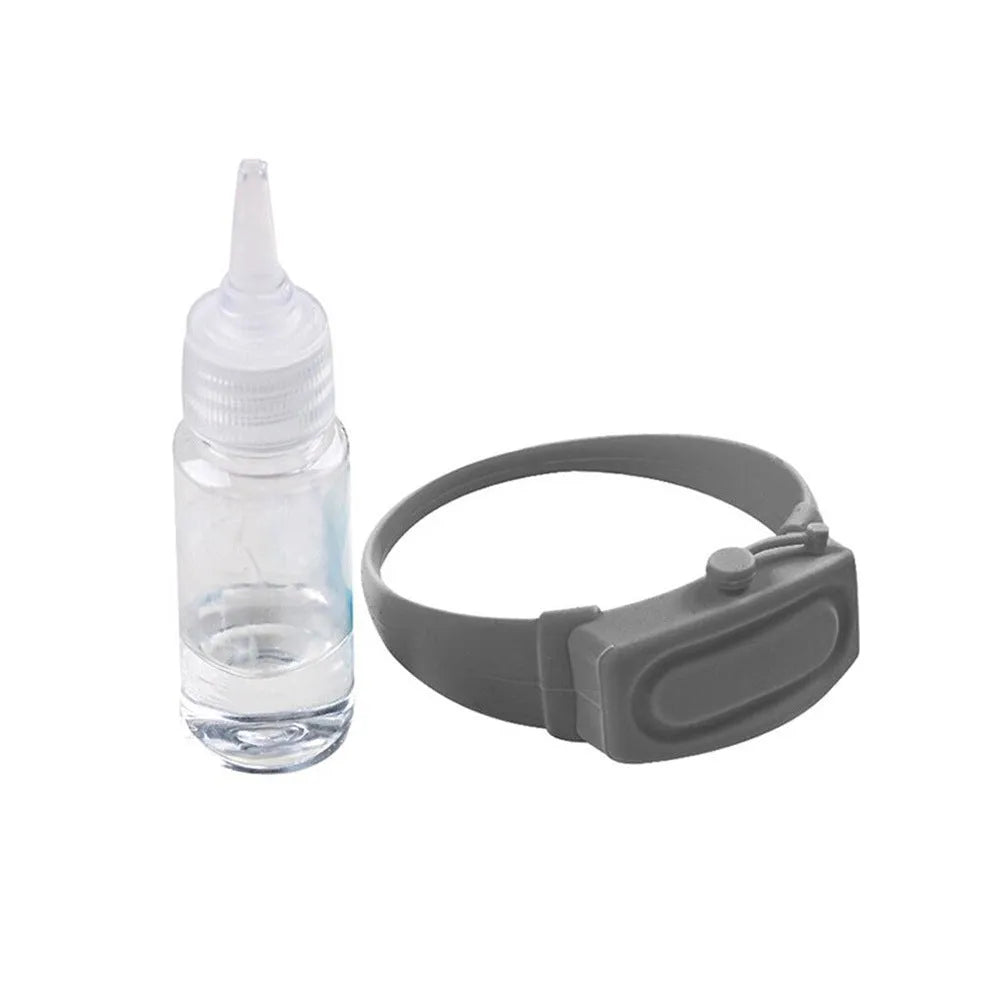 Portable hand sanitizer dispenser silicone wristband with refill cap, black band holding 6mL bottle