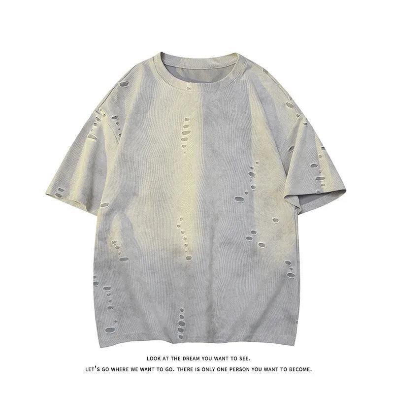 Men's blue cotton blend ripped short sleeve t-shirt showing relaxed fit and distressed detailing