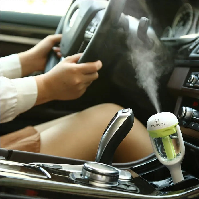 Compact blue car humidifier diffuser with mist output and rotation feature