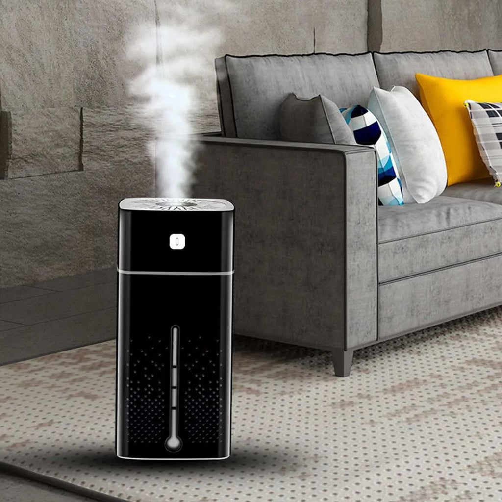 Black and white compact desktop humidifier with USB cable and 1000ml water tank.