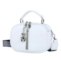 Oval-shaped women's small square handbag in PU with stitching detail and double straps.