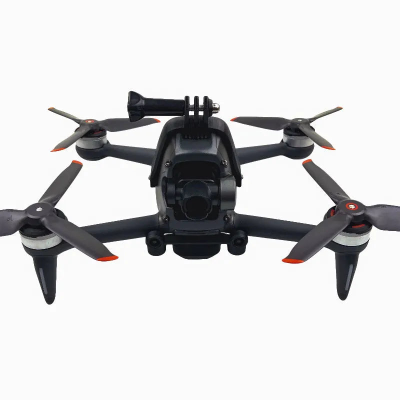 3D printed hard plastic FPV drone top expansion bracket with grey sponge padding for GoPro cameras.