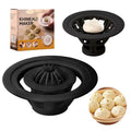 Four identical black plastic steamed bun moulds for making baozi and dumplings