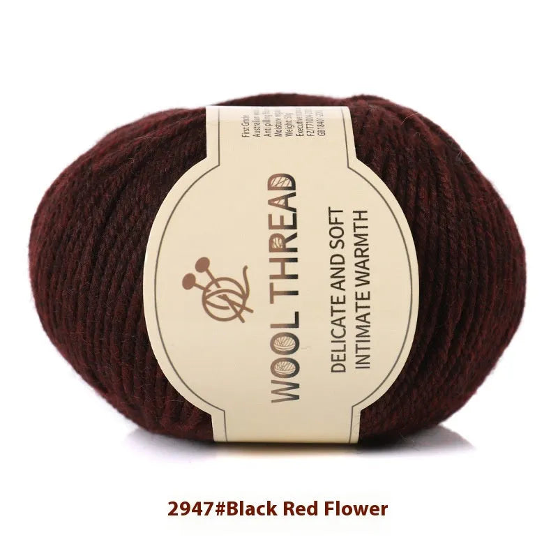 One roll of beige domestic wool hand-knitting yarn for size 10 needles next to knitting needles.