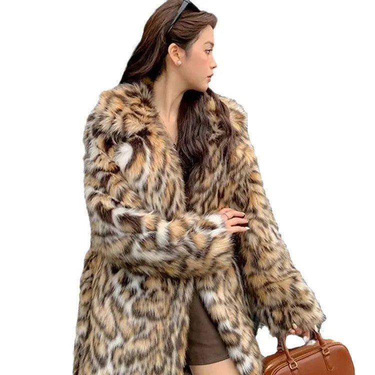 A long faux fur coat with a fox fur-style collar, shown in a street fashion context.