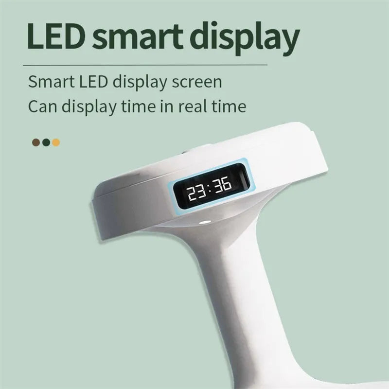 White columnar anti-gravity humidifier with LED clock display and mist output on a wooden desk.