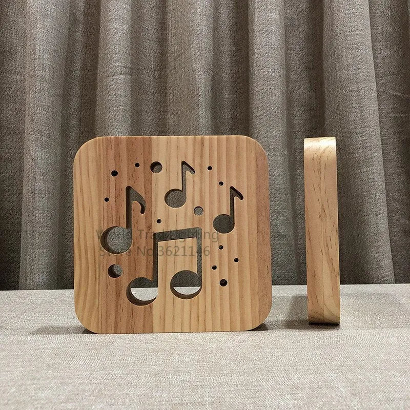 Square pine wood USB LED lamp emitting warm white light on a wooden surface.