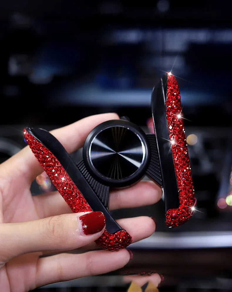 Car buckle mobile phone holder in ABS plastic on a car dashboard with a smartphone in place