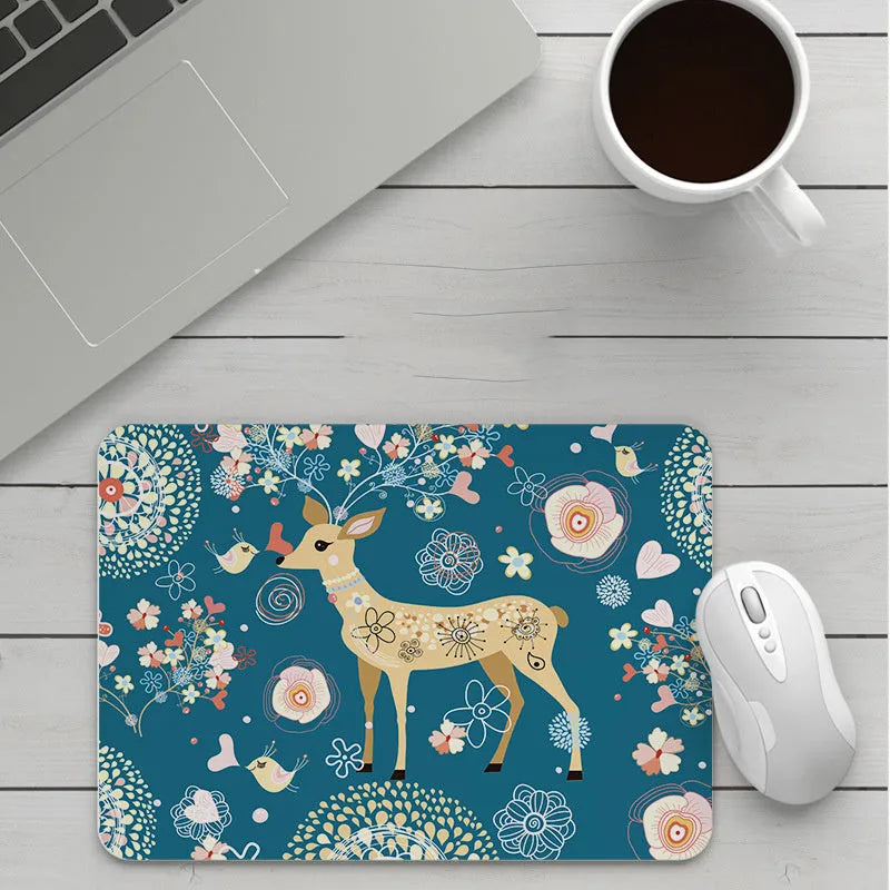 Thick custom cartoon mouse pad with colourful design on a desk, showing black seam edge