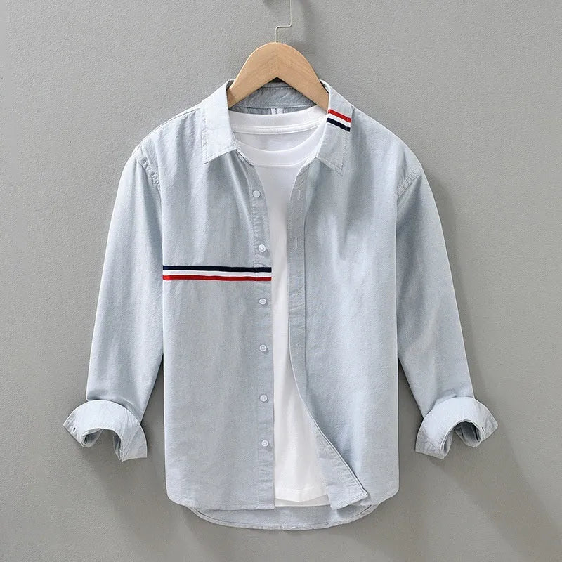 Hong Kong style loose fit cotton blend shirt in light blue, showing cardigan design on a hanger.