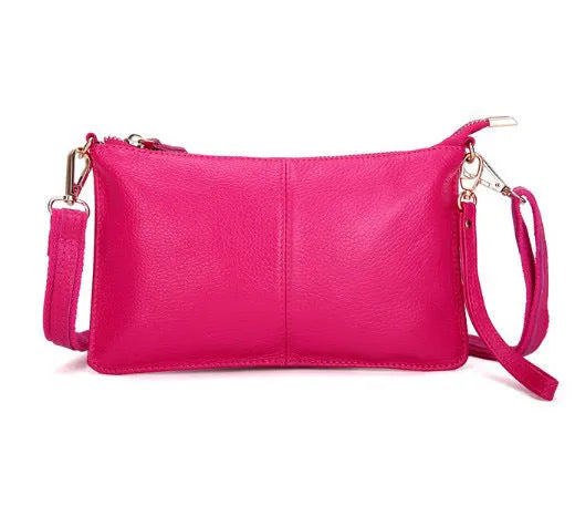 A cowhide lady slant bag in a chosen colour, showing hand and shoulder straps, with dimensions of 24 cm by 14 cm.