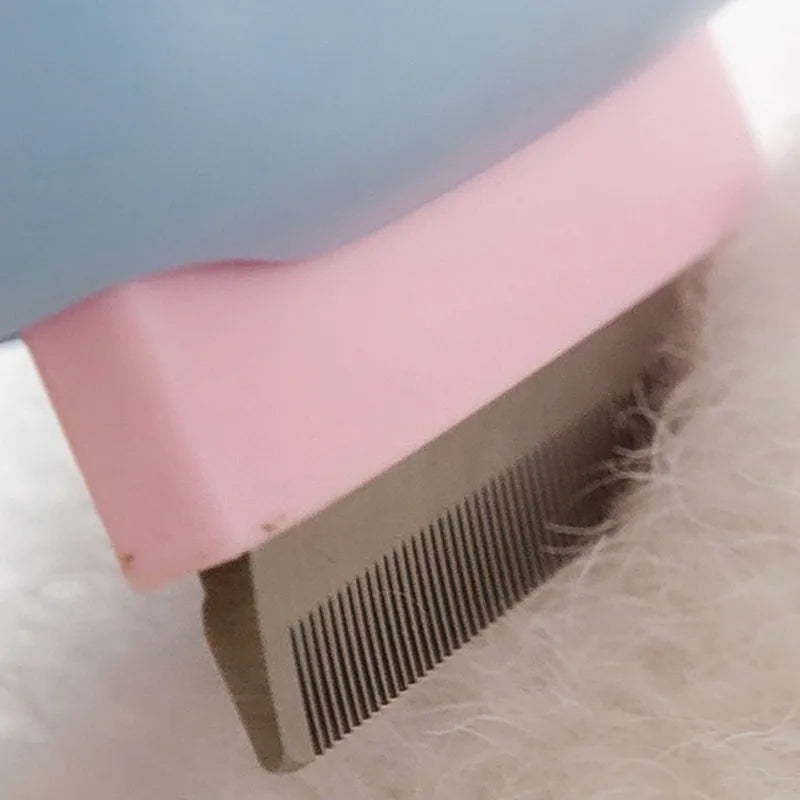 Blue and green double-sided pet grooming brush with deshedding rake and dematting comb.