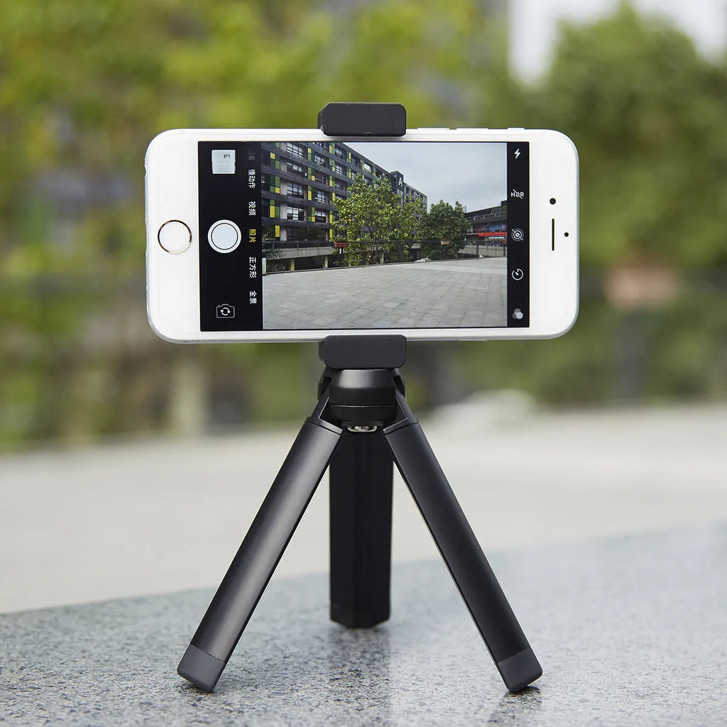 Silver aluminium bracket clip for mounting an iPhone onto a table top tripod.