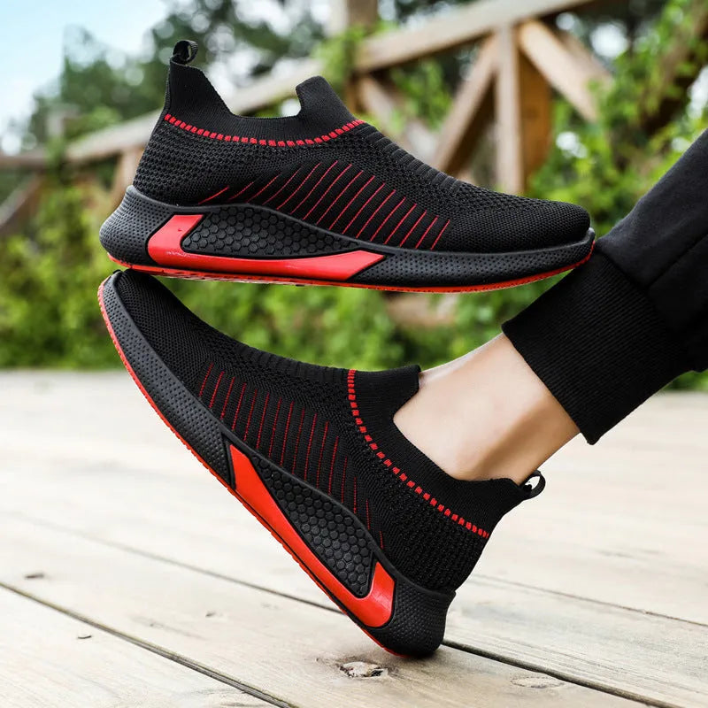Men's black and white striped mesh slip-on sneakers with flyknit upper and lace-up front