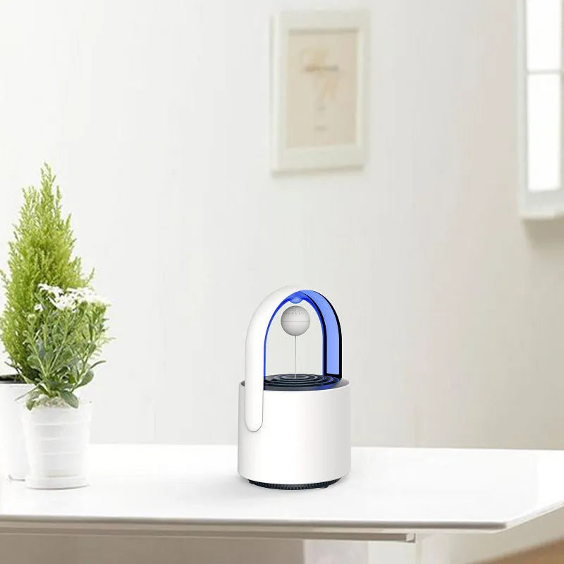 USB mini mosquito repellent lamp with 5W 365nm LED in Purple colour on a desk