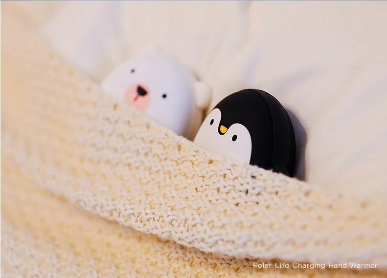 Cartoon penguin and polar bear design USB rechargeable hand warmer showing front and back.
