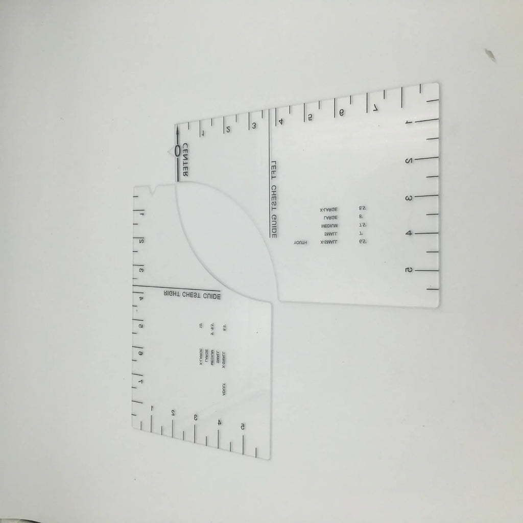 Transparent acrylic sewing ruler for T-shirt alignment and patch placement on fabric.