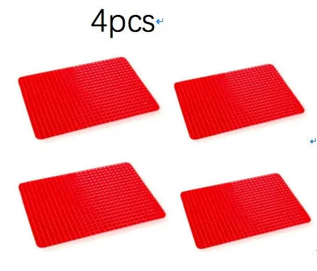 Red silicone pyramid grid cooking mat on a kitchen countertop.