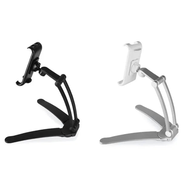 Silver aluminium alloy tablet stand with adjustable black clips holding a tablet, showing 360-degree rotation on a wooden desk.