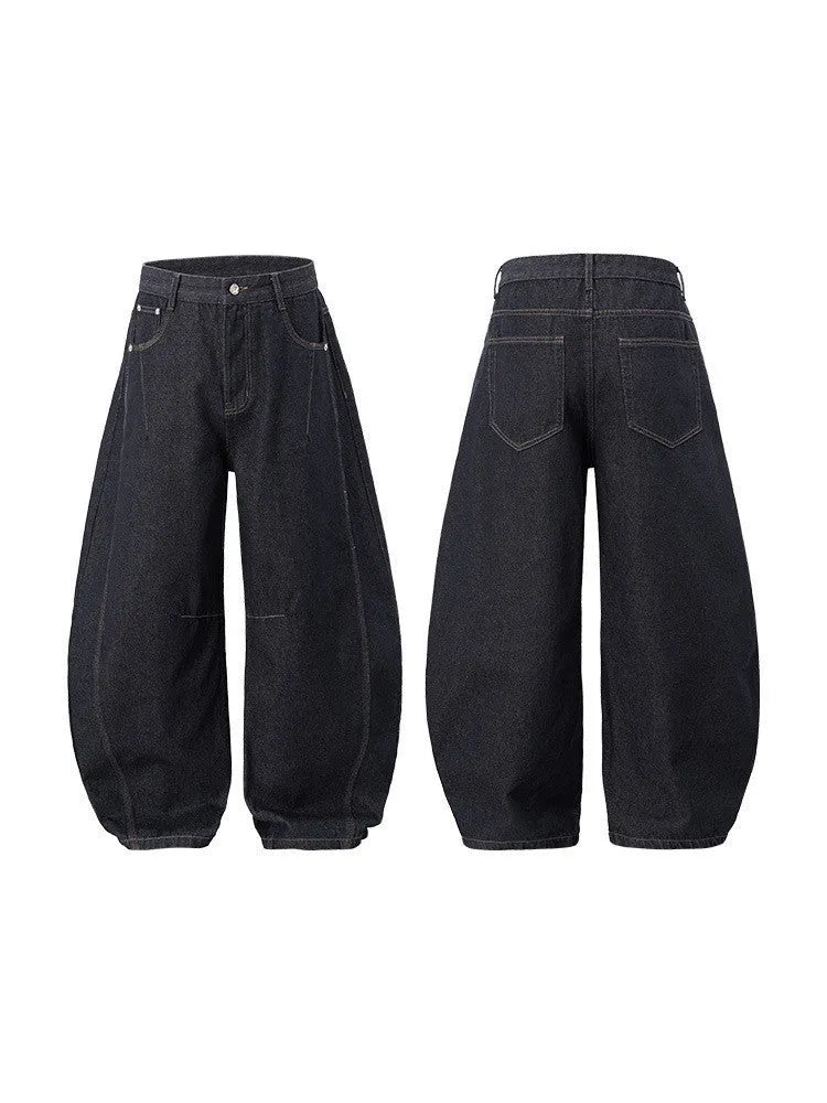 Men's wide leg denim trousers in original cow colour showing mid waist and relaxed fit.