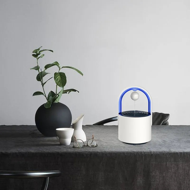 USB mini mosquito repellent lamp with 5W 365nm LED in Purple colour on a desk