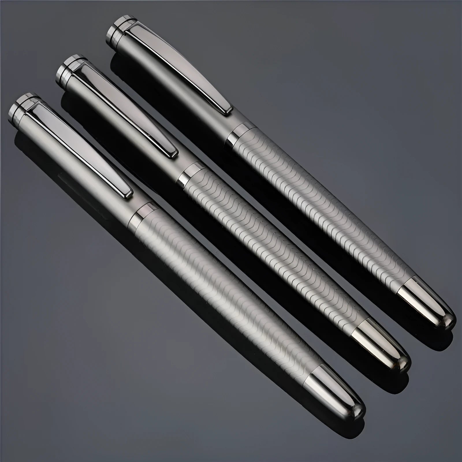 Fog gun grey metal signature pen with bullet nib and 0.5mm line width on dark table
