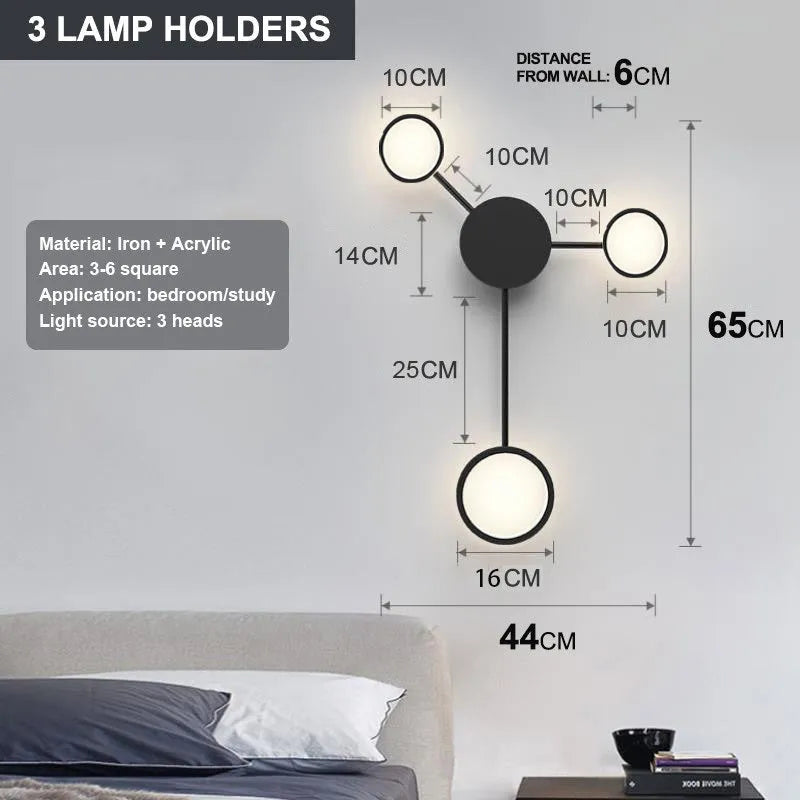 Contracted designer wall lamp with 6 heads in black iron and acrylic mounted on a bedroom wall