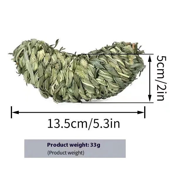 Natural timothy grass pet toy shaped like an eggplant, on a light background