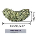 Natural timothy grass pet toy shaped like an eggplant, on a light background
