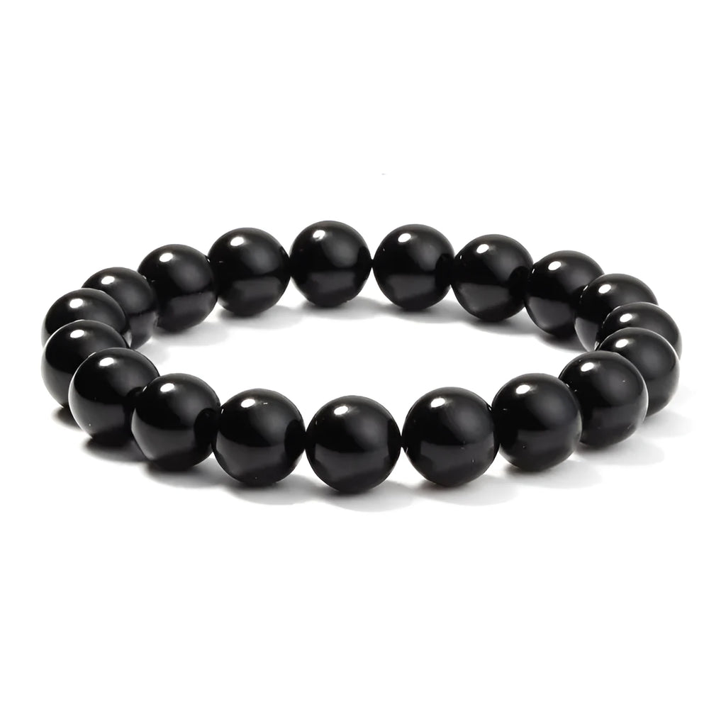 Black onyx bracelet with 8mm geometric beads on a stretchy elastic cord.