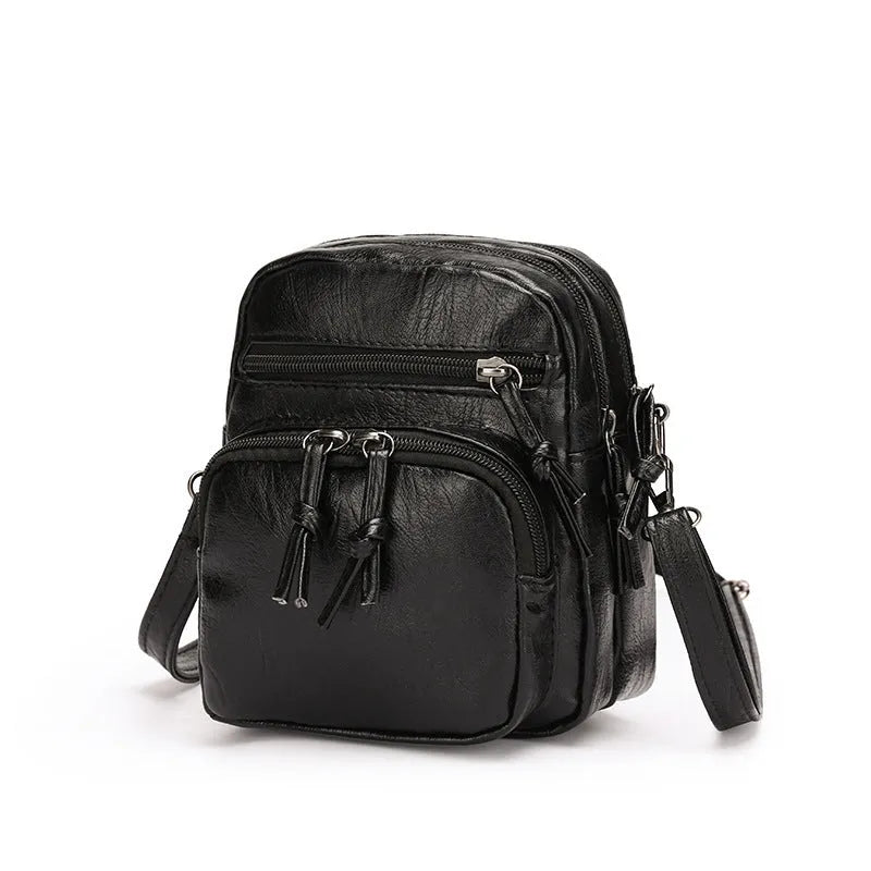 Soft PU leather mini shoulder bag with chain detail in black and brown colour options