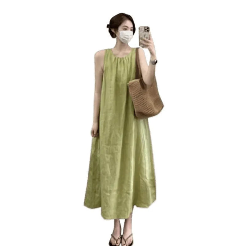 Plus size sleeveless asymmetric cotton blend vest skirt in green with matching black trousers, mid-length street fashion style