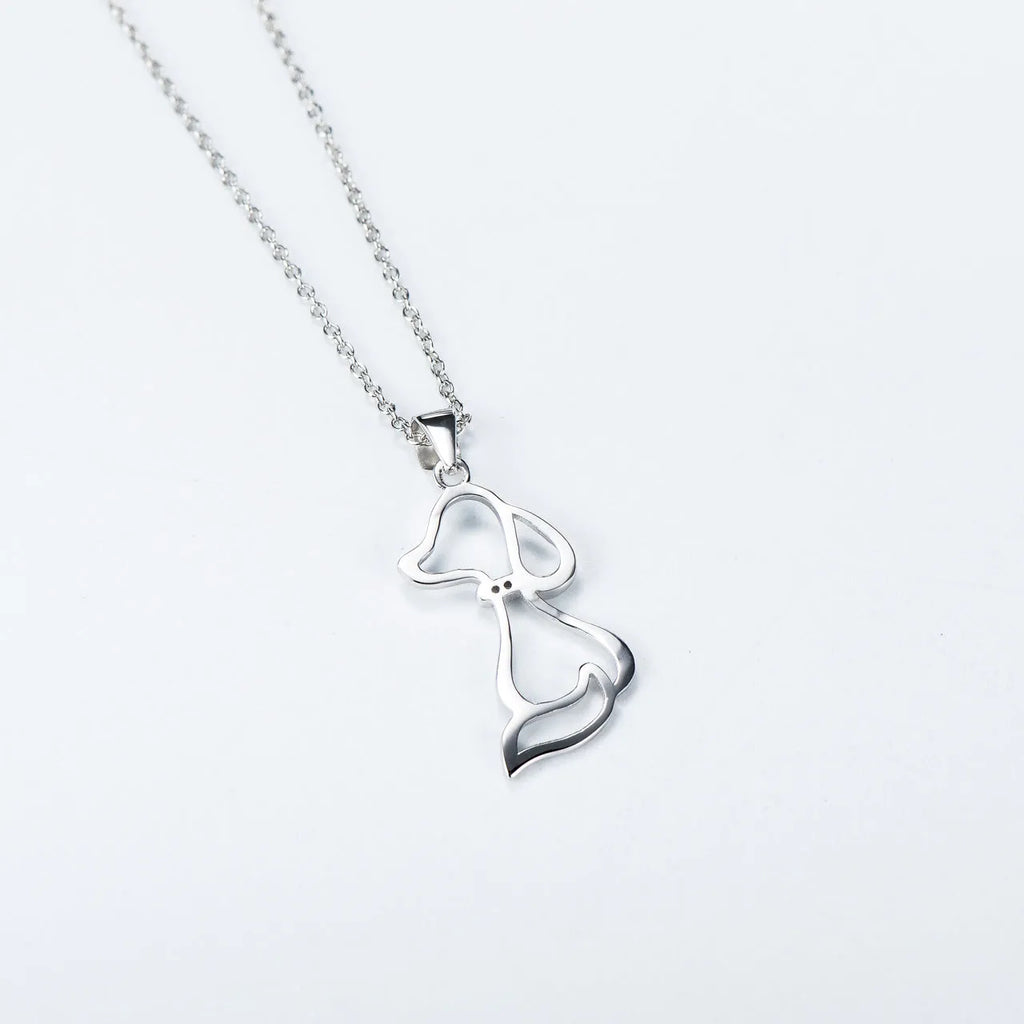 Ladies 925 sterling silver dog pendant necklace with adjustable round bead chain on neutral background