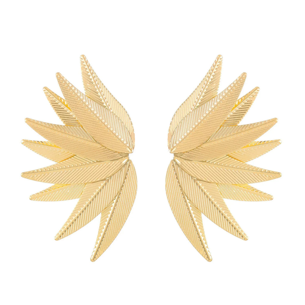 A pair of gold or white alloy earrings shaped like a leaf.