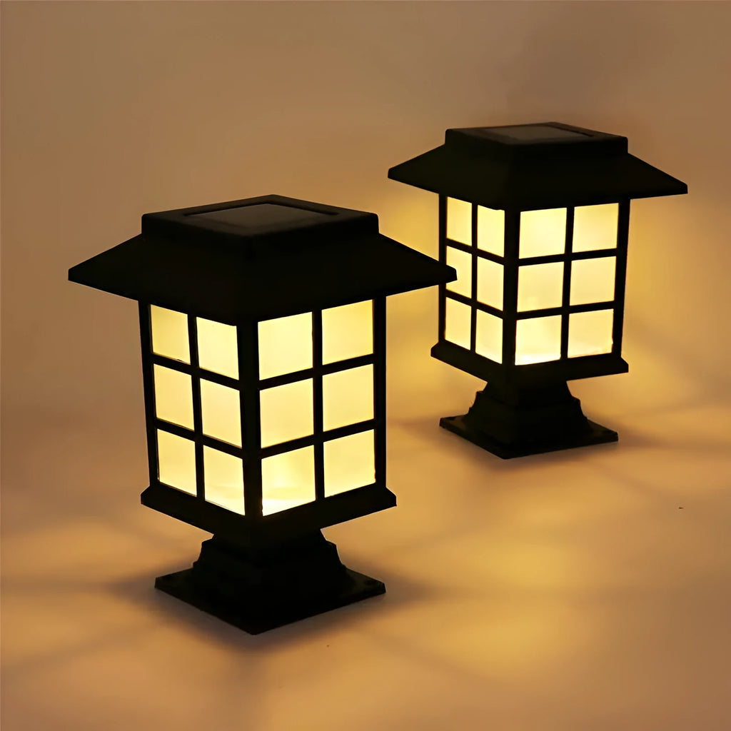 Black solar-powered LED lawn light for outdoor garden and pathway illumination.