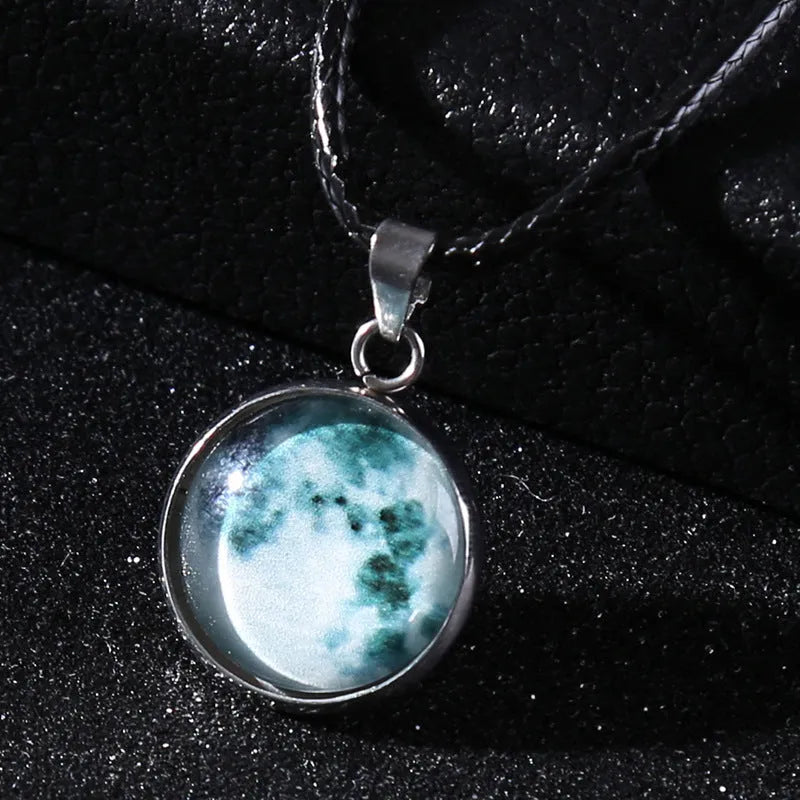 Luminous Christmas moon and starry night sky alloy pendant necklace with coloured glass centrepiece on a chain.
