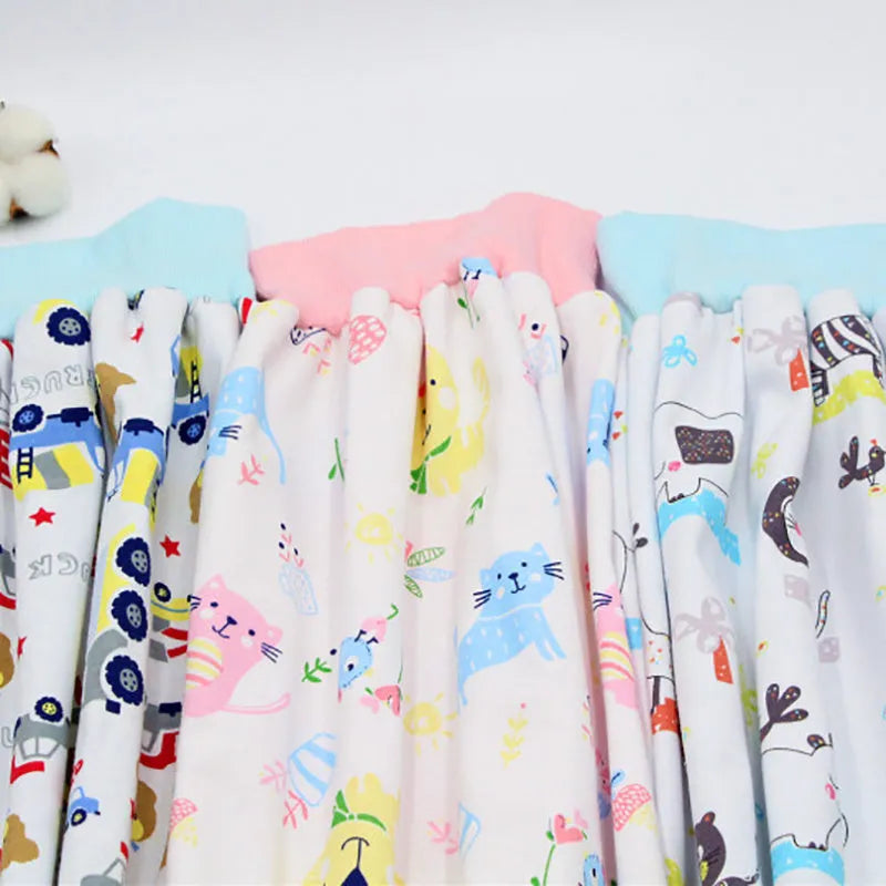 Waterproof baby diaper skirt with organic cotton surface, adjustable waist, and multi colour options including Bear car and Cat.